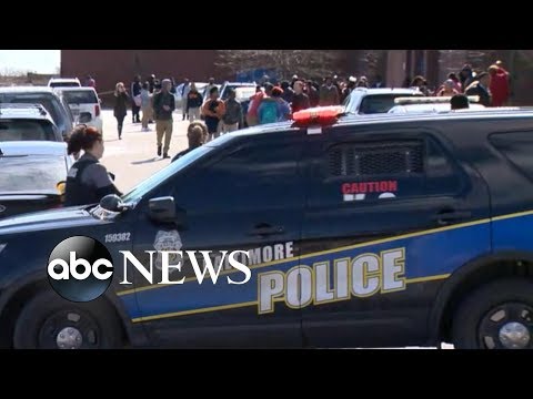 Baltimore high school staff member shot in school episode artwork