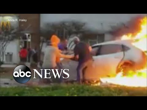 Bystanders rescue woman trapped in burning car episode artwork