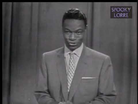 Frankie Laine and Nat King Cole share some laughs and song episode artwork