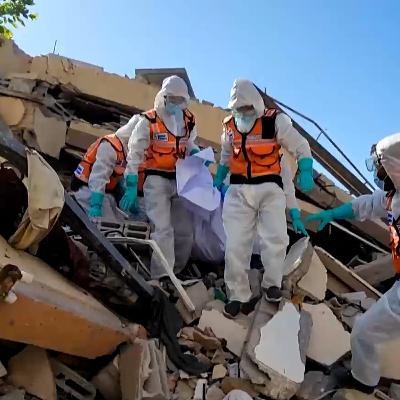 Emergency teams move hastily buried Palestinians to cemeteries