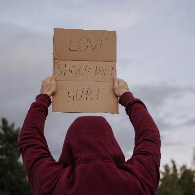 What are some of the root causes and early signs of domestic violence?