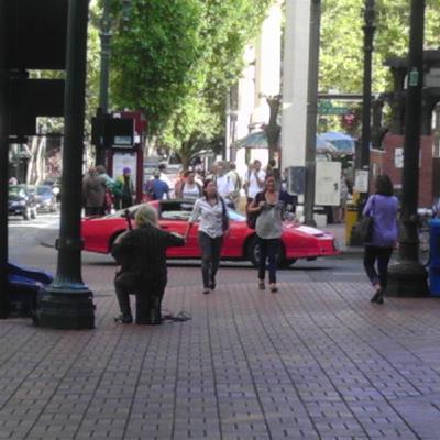 Heart-wrenching cello busker...pretty amazing stuff. Pio Square, Portland