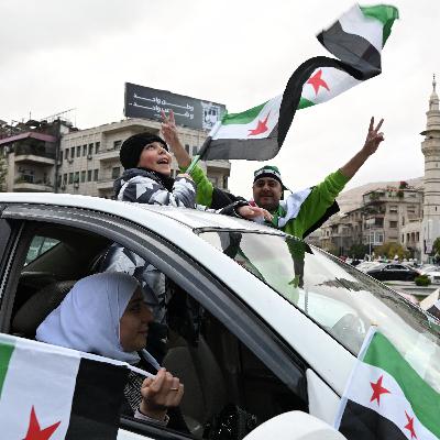 Celebrations, military parade mark one year since fall of Assad