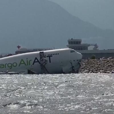 Two killed as cargo plane skids off Hong Kong runway