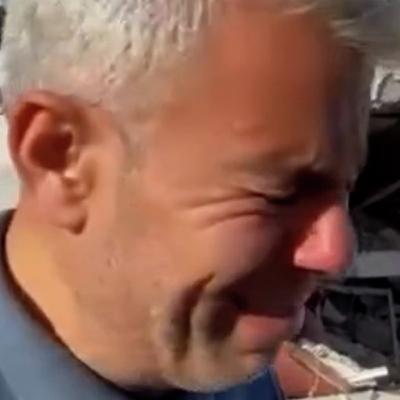 Palestinian journalist cries over ruins of destroyed home