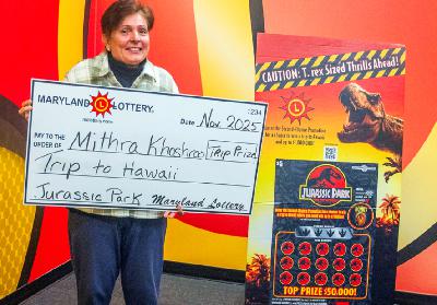 John Martin of Maryland Lottery updates Nestor on several scratch off promotions and big trip winners