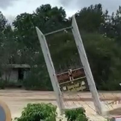 Video shows the moment a bridge is swept away by floodwaters in Vietnam
