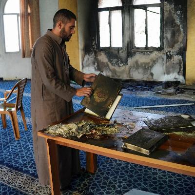 Israeli settlers torch and deface a mosque in a Palestinian village in the occupied West bank