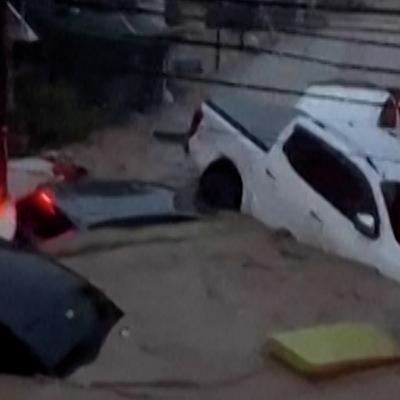 Typhoon floods wash away cars and shipping containers in Philippines