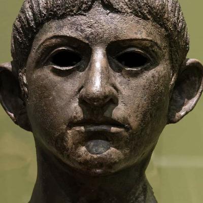 42: 1. LONDINIUM 91 CE. Seven Warnings, Part I. Gaius and Germanicus, joined by retired centurions, convened at the Friends of History Debating Society to discuss Germanicus's list of seven maxims detailing how empires, specifically the US, engage in self-har