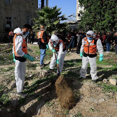 Dozens of bodies hastily buried at al-Shifa Hospital moved to graveyards