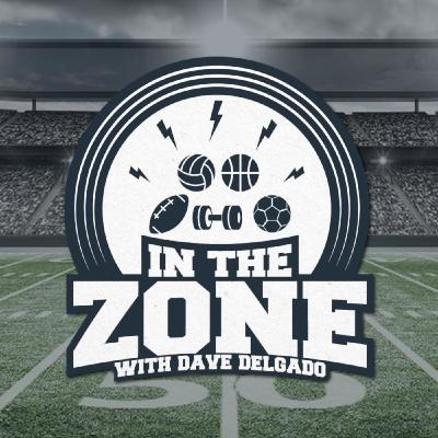 Dave Delgado sits with Team Guam pitcher Pete Perez