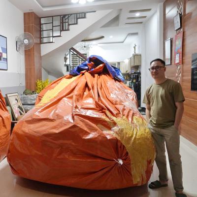 Tin trong nước - Người dân Đà Nẵng dùng bạt bọc kín ô tô trong nhà phòng mưa bão