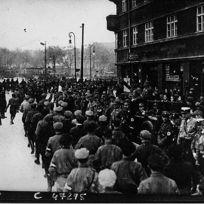 S8 Ep549: 5. Following the November defeat, Hitler faced internal party rifts between Gregor Strasser’s coalition-building and Joseph Goebbels’ hardline stance. A farcical "underwear scene" occurred when Hitler was pulled off a train to prevent a compromise with Sc