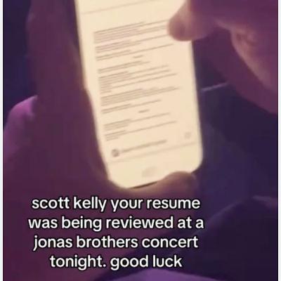 What was someone looking at while at a Jonas Brothers concert?