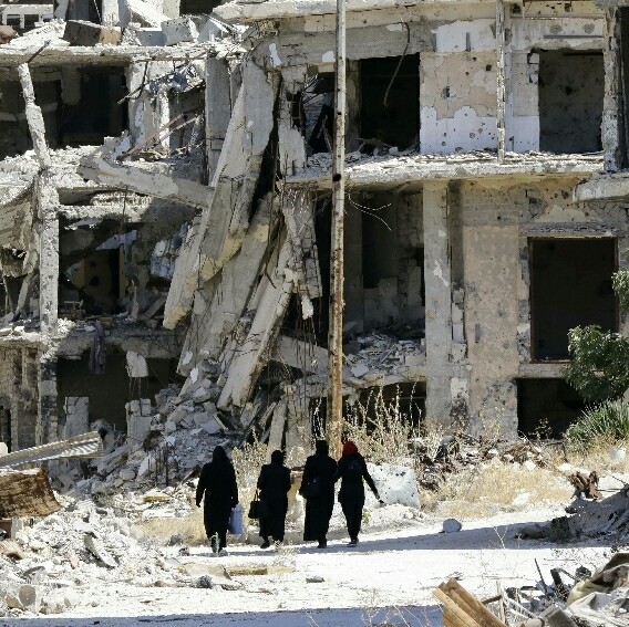 Dozens dead after suicide attacks, gun battles at bases in Syria’s Homs